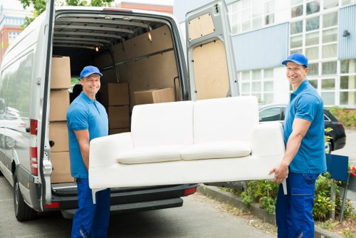 Careful loading of office furniture for a business move near Shoreditch