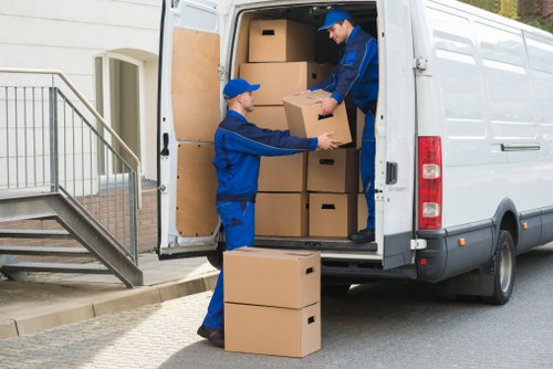 Local movers handling office equipment in a Shoreditch building