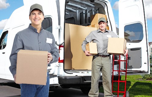 Careful loading of furniture collection van in East London