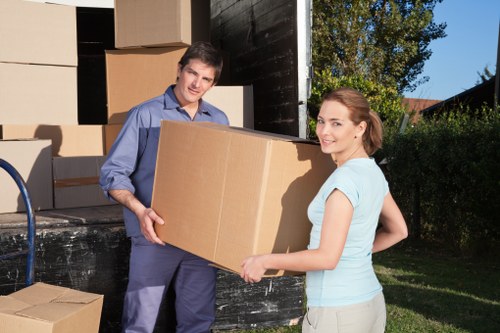 Specialist movers navigating tight access in a Shoreditch property